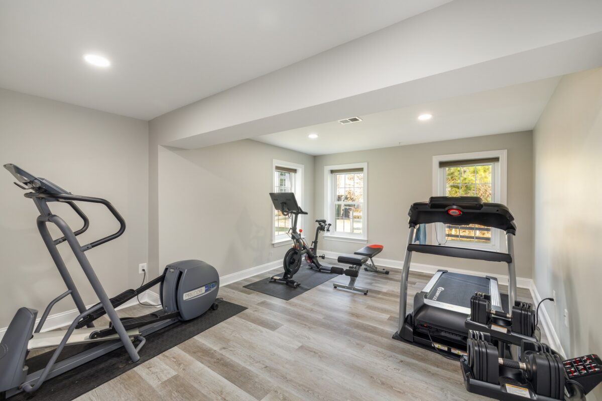 Lower Level Fitness Center - Multi-Zone Lower-Level Living & Home Fitness Center by Sam's Remodeling