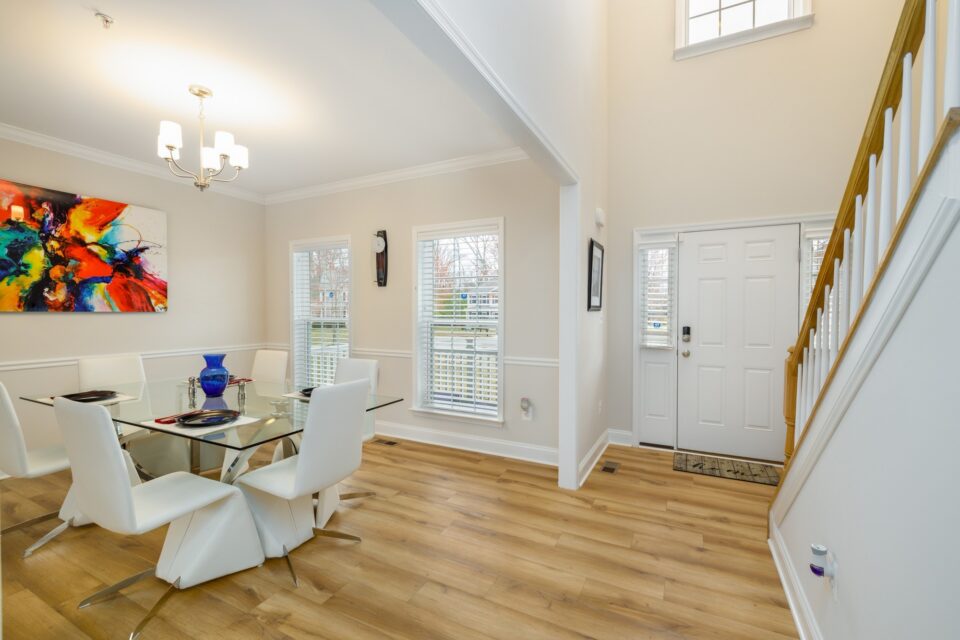 Open Living Dining Entry - Open-Concept Main Level Reconfiguration & Custom Dressing Suite by Sam's Remodeling