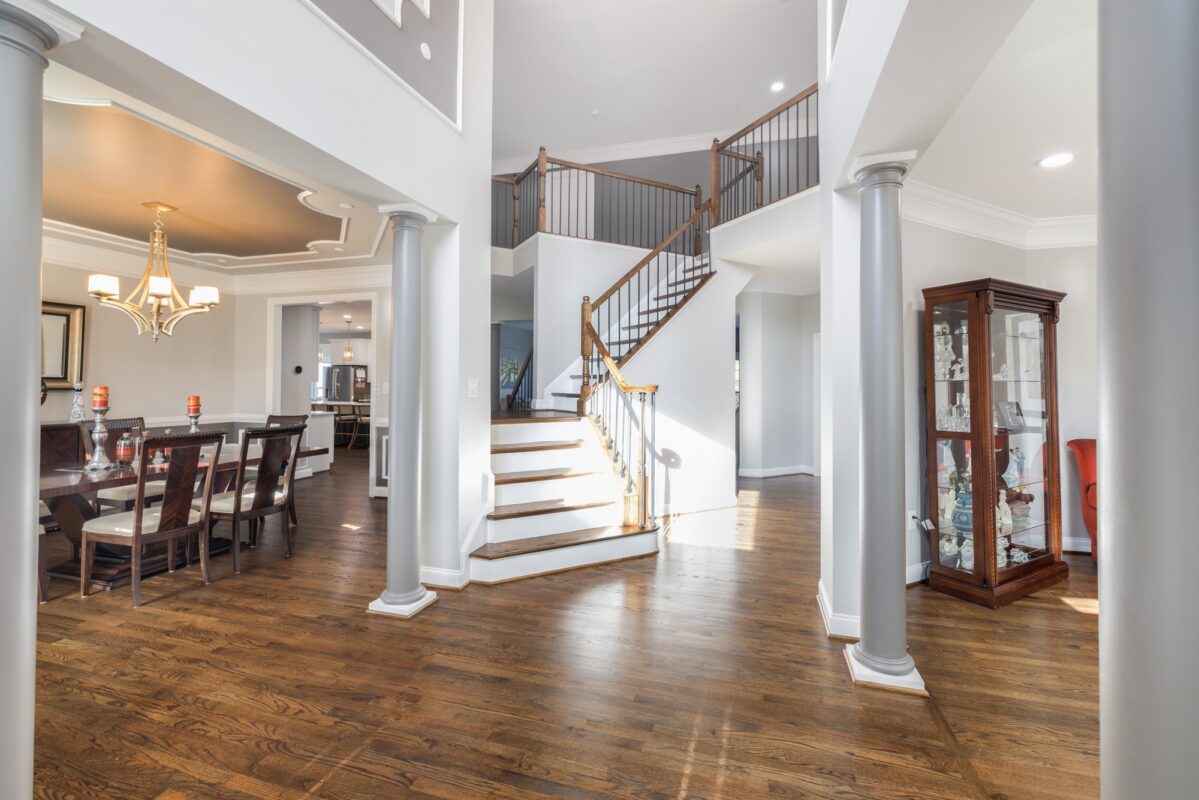 Grand Foyer Staircase Living - Multi-Level Architectural Transformation & Custom Millwork by Sam's Remodeling