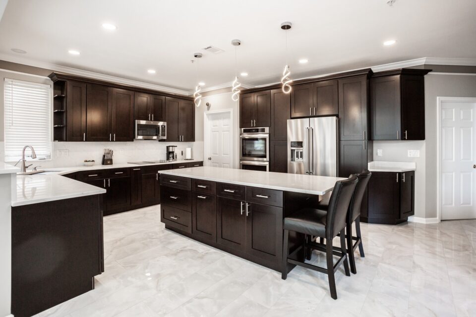 Modern Espresso Suite Island - Modern Espresso Suite & Full-Height Quartz Backsplash by Sam's Remodeling