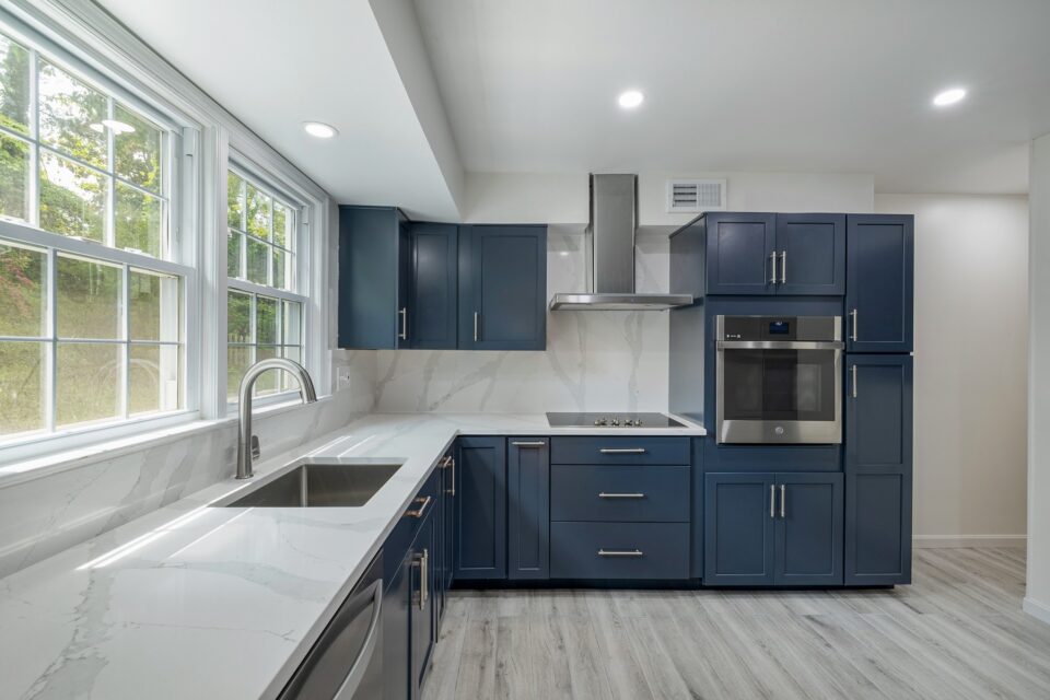 Navy Shaker Wall Oven Suite - Bold Navy Shaker Suite & Seamless Quartz Slab by Sam's Remodeling